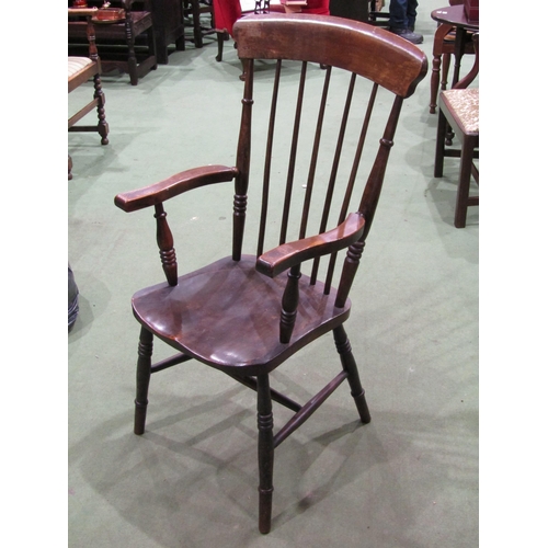 4062 - An early 20th Century stick back grandfather's chair on turned legs to 'H' stretcher base