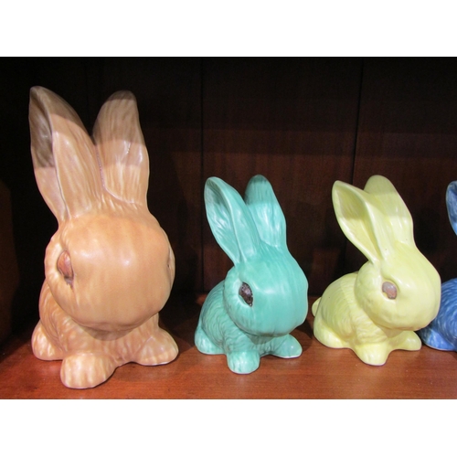 A collection of assorted Sylvac rabbits in various colours including ...