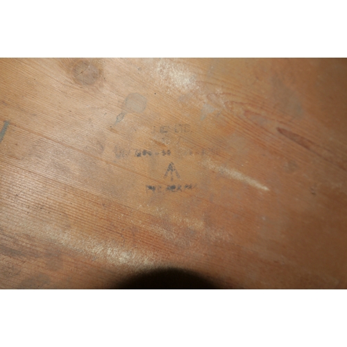 2035 - An Ex-military folding pine topped table, 180cm long