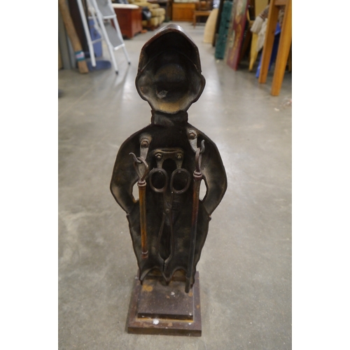 2052 - A cast iron Dutch Boy companion set