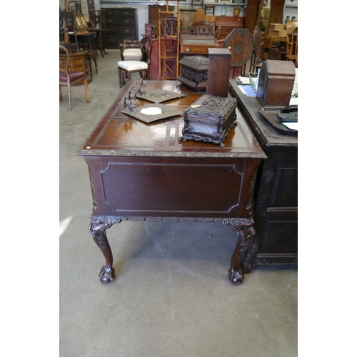2003 - A Georgian style mahogany four drawer, leather topped, writing desk