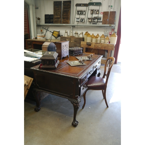 2003 - A Georgian style mahogany four drawer, leather topped, writing desk