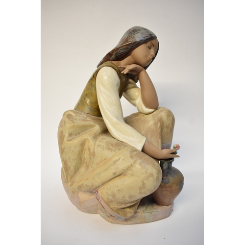 1001 - A large Lladro matte figure of lady holding rose, back foot missing, 37cm tall