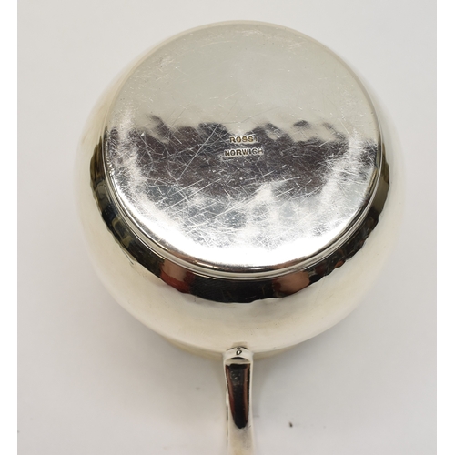 8046 - A Theodore Rossi silver cream jug with banded neck, London 1918, base marked Rossi Norwich.  186g