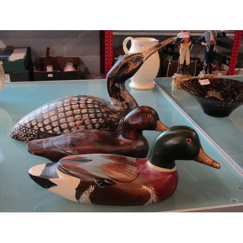1014 - Two carved and painted ducks with metal beaks and a similar grebe (3)