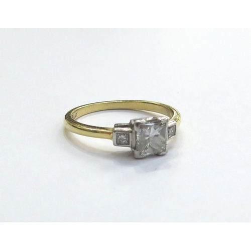 6035 - An 18ct gold platinum set Princess cut diamond solitaire ring, with four corner claws and a smaller ... 