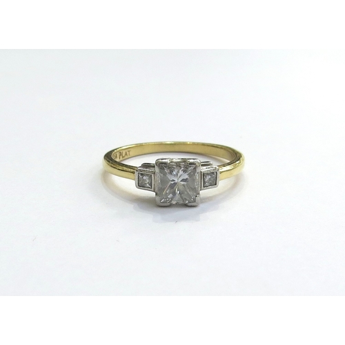 6035 - An 18ct gold platinum set Princess cut diamond solitaire ring, with four corner claws and a smaller ... 