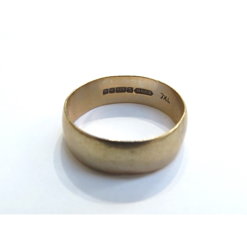 6517 - A 9ct gold wide wedding band. Size U, 4g
