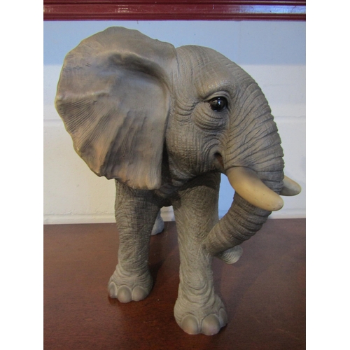 1013 - A resin figure of an elephant, 34cm tall