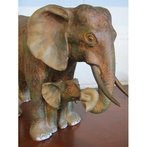 1015 - A large elephant family resin figural group, 32cm high approx