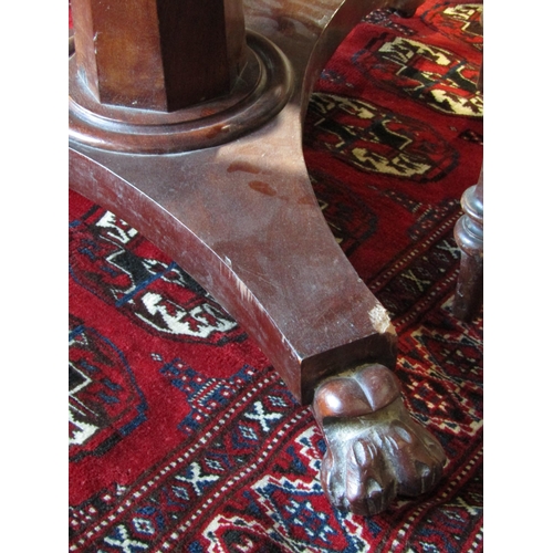 1018 - A 19th Century mahogany pedestal table, circular top over a faceted column to plateau base, 90cm dia... 