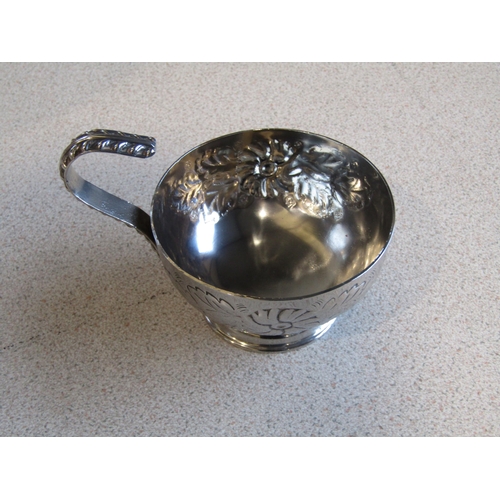 1021 - A silver on copper punch bowl with six cups, lion mask ring handles, foliate and melon fluted design... 
