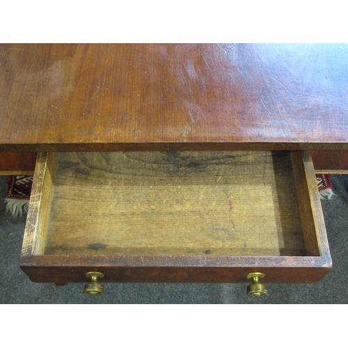 1022 - An early 20th Century mahogany sofa table, single drawer over turned spindle stretcher