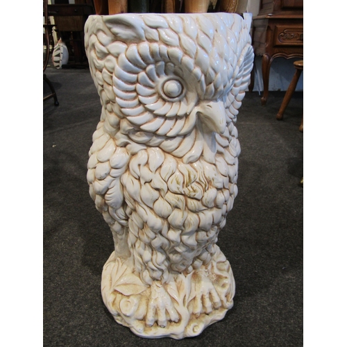 1024 - A ceramic owl form stick stand (large chip) containing a quantity of assorted walking sticks includi... 