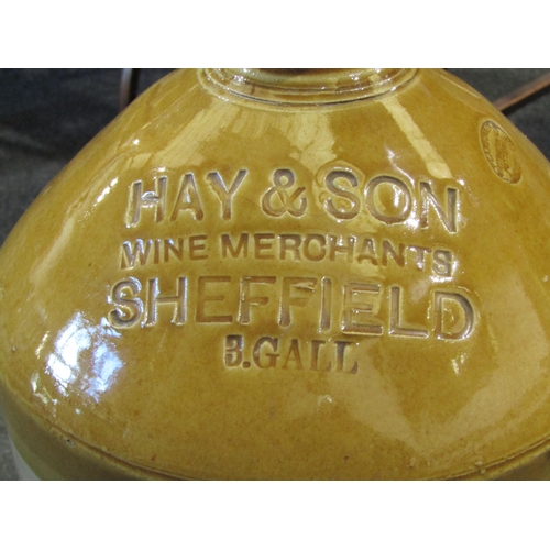 1030 - Two stoneware flagons including Hay & Son Wine Merchants, Sheffield