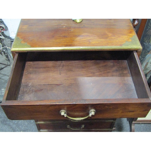 1040 - A campaign style brass bound hardwood chest of eight drawers, brass handles, 100cm tall x 50cm wide ... 