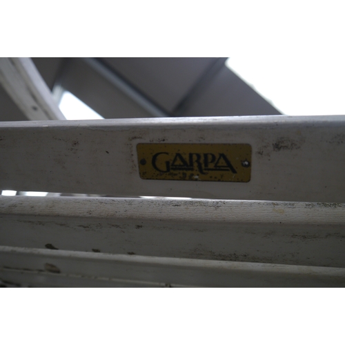 2001 - A Garpa wrought iron and cedar wood garden table and set of four chairs