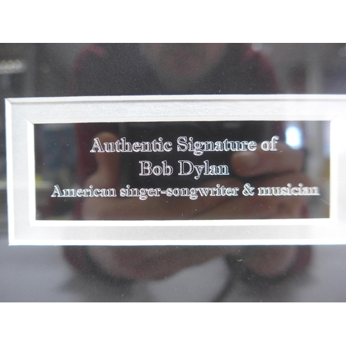 Bob Dylan autograph - An album page signed in black ink by Bob Dylan ...