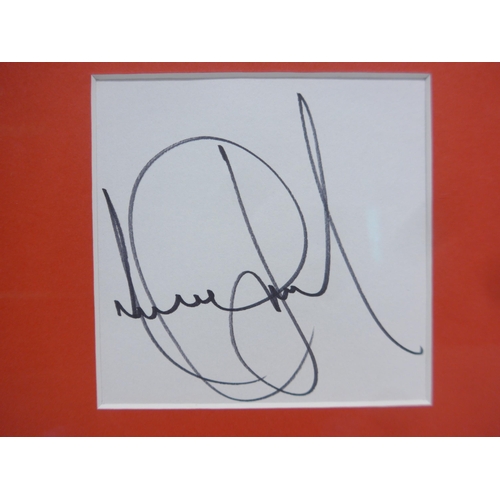 8298 - Michael Jackson autograph - A white card signed in black marker pen by Michael Jackson, mounted with... 