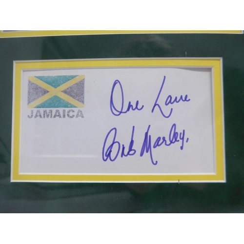 8287 - Bob Marley autograph - A white card with the Jamaican flag to corner signed in blue marker pen 