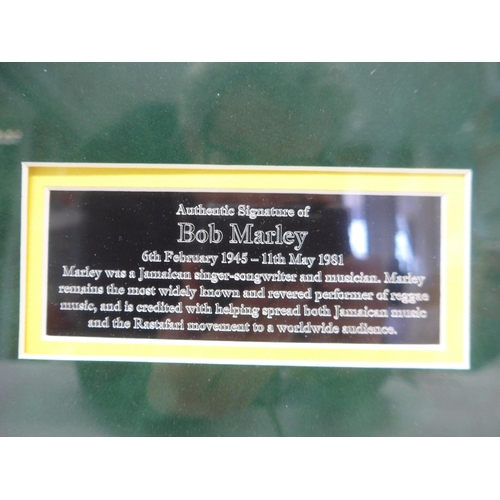 8287 - Bob Marley autograph - A white card with the Jamaican flag to corner signed in blue marker pen 