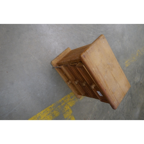 2053 - A small pine chest of four drawers, 37cm tall