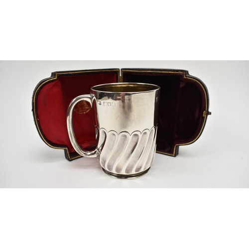 8027 - A Goldsmiths & Silversmiths Company silver half pint tankard with wrythen body monogrammed HML, date... 