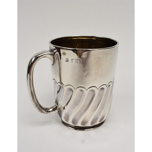 8027 - A Goldsmiths & Silversmiths Company silver half pint tankard with wrythen body monogrammed HML, date... 