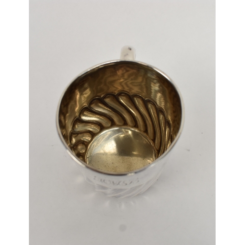8027 - A Goldsmiths & Silversmiths Company silver half pint tankard with wrythen body monogrammed HML, date... 