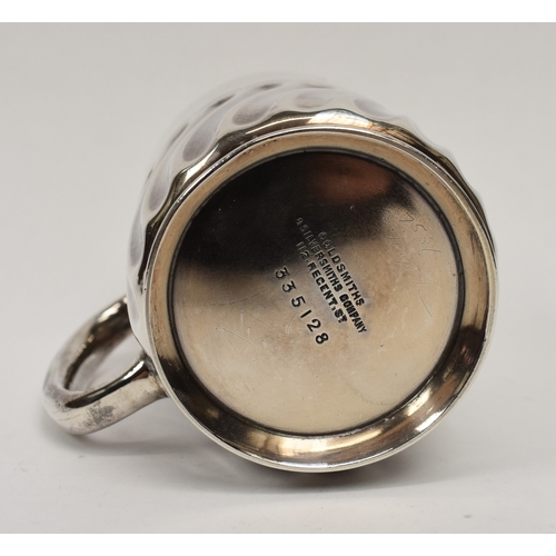 8027 - A Goldsmiths & Silversmiths Company silver half pint tankard with wrythen body monogrammed HML, date... 