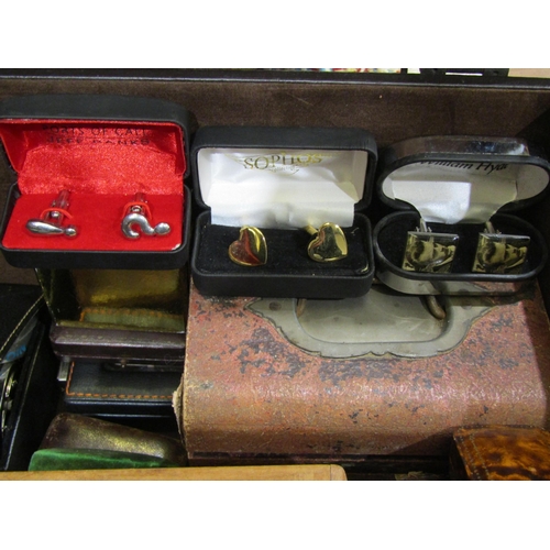 4002 - A box containing a collection of costume jewellery including cufflinks, hat pins, semi-precious ston... 