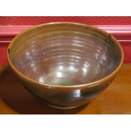 4018 - A studio pottery bowl, 25cm diameter, two similar lidded pots with maker's marks, a jug and tea bowl... 