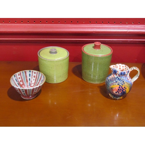 4018 - A studio pottery bowl, 25cm diameter, two similar lidded pots with maker's marks, a jug and tea bowl... 
