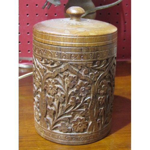 4031 - A carved treen box, lidded container and two table lamps (4)