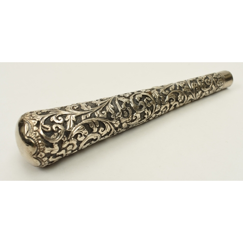 8016 - A highly ornate white metal cane handle, 15.5cm long