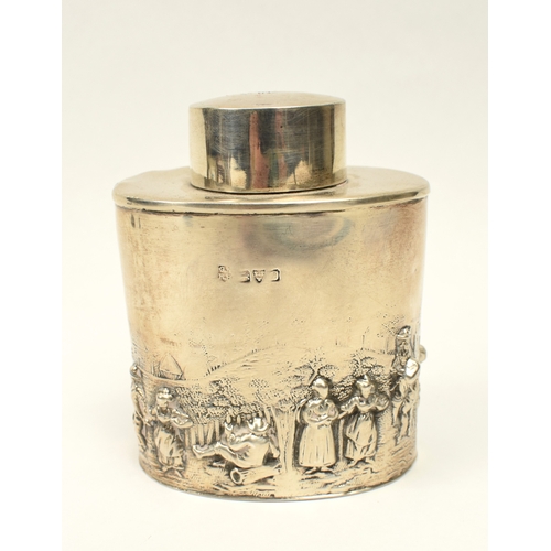 8018 - A silver tea caddy with high relief figural scene, marks rubbed, dents present, 8.2cm x 6.7cm, 71g