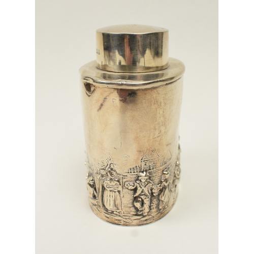 8018 - A silver tea caddy with high relief figural scene, marks rubbed, dents present, 8.2cm x 6.7cm, 71g