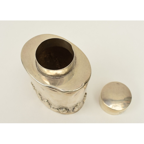 8018 - A silver tea caddy with high relief figural scene, marks rubbed, dents present, 8.2cm x 6.7cm, 71g