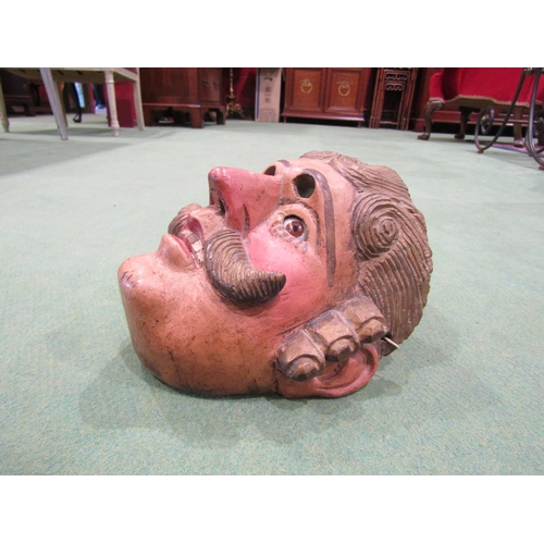 4060 - Two South American wooden masks, a Bull and a painted gent with moustache