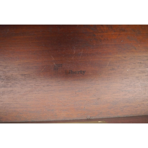 2006 - A Liberty of London leather topped faux bamboo desk on brass castors
