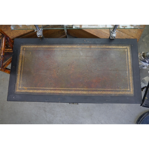 2006 - A Liberty of London leather topped faux bamboo desk on brass castors