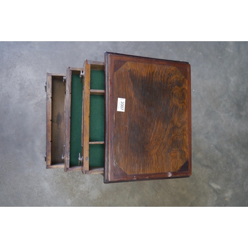 2007 - An Edwardian three drawer table top needle chest with reverse gilt painted panels to each drawer