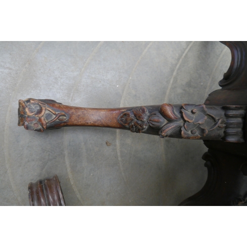 2020 - A heavily carved rosewood and mahogany table base