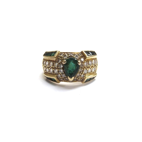 6046 - A gold emerald and diamond ring, stamped 750. Size L, 6.5g