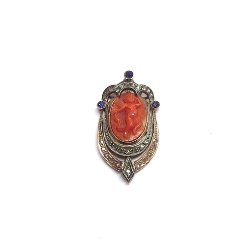 6041 - A pendant with carved coral Putti framed by old cut diamonds and three blue sapphires to top, unmark... 