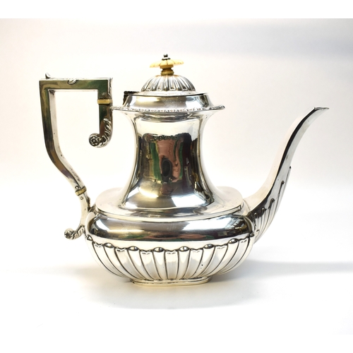 8037 - An F.B. & Co silver teapot with melon fluted body, Birmingham 1904, ivory knop and insulators.  21.5... 