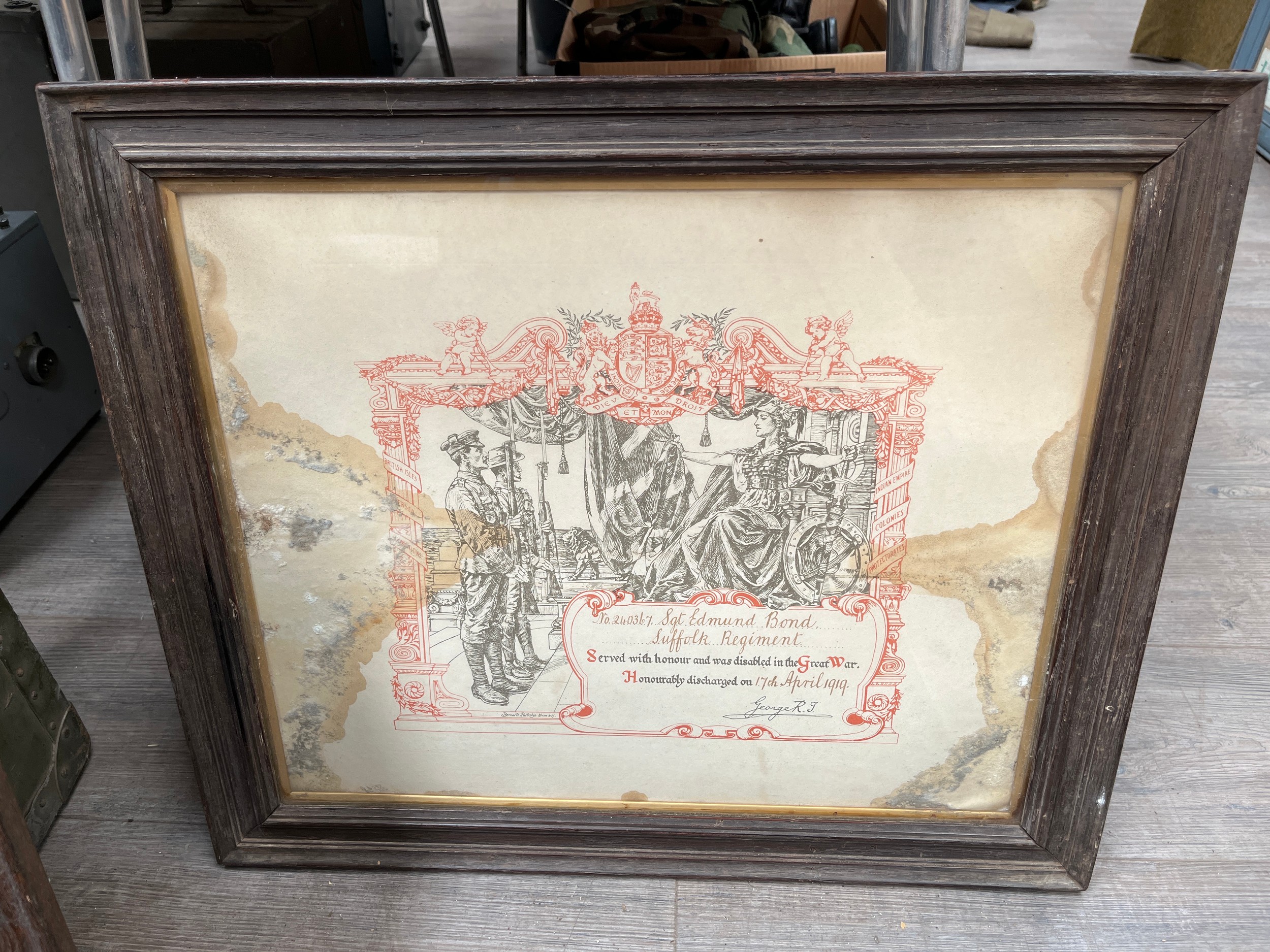Three Suffolk Regiment framed items including scroll (a/f) and others