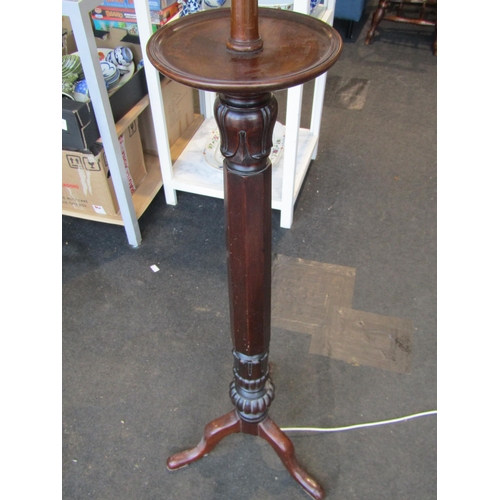 1009 - A Victorian style mahogany standard lamp with fluted carved detail, cream shade