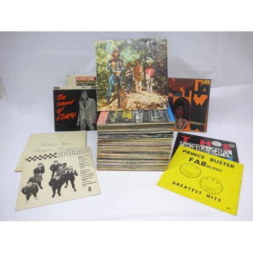 8213 - A varied collection of approximately seventy LPs, artists include The Rolling Stones, The Beatles, T... 