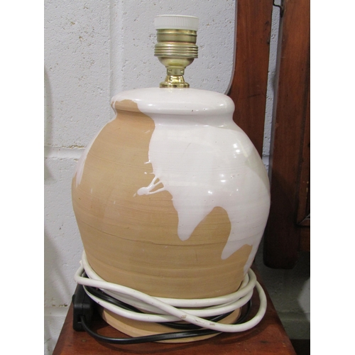 1023 - A pair of glazed terracotta table lamp bases